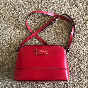 Kate Spade purse; red in color; can be worn on shoulder or as crossbody